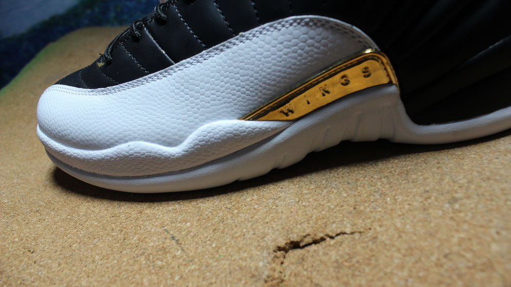 Air Jordan 12 Wings Black White Gold Sneakers 848692-033 - product image from the listing.