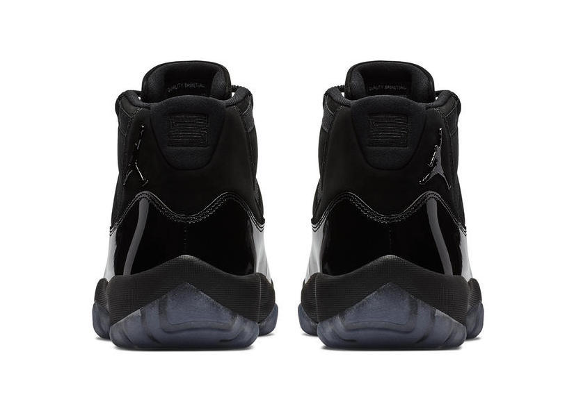 Air Jordan 11 Cap and Gown High-Top Sneakers in Black - product image from the listing.