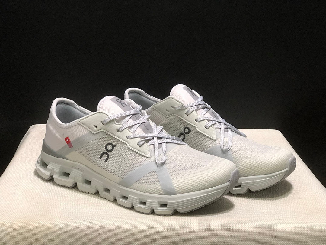 On Cloud X 4 AD Sneakers in Wolf/Alloy in Light Gray - product image from the listing.