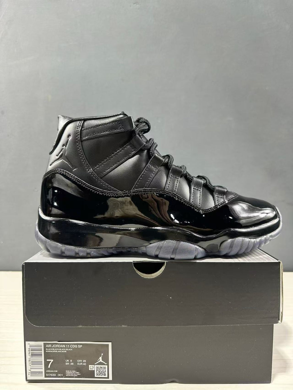 Comme des Garçons × Jordan Air Jordan 11 Sneakers in Black - product image from the listing.