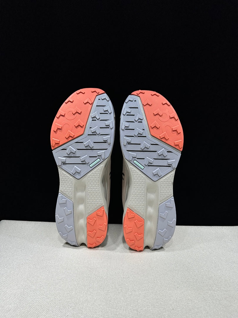 On Cloudsurfer Trail 2 Trail Running Shoes, in Ivory and Coral - product image from the listing.