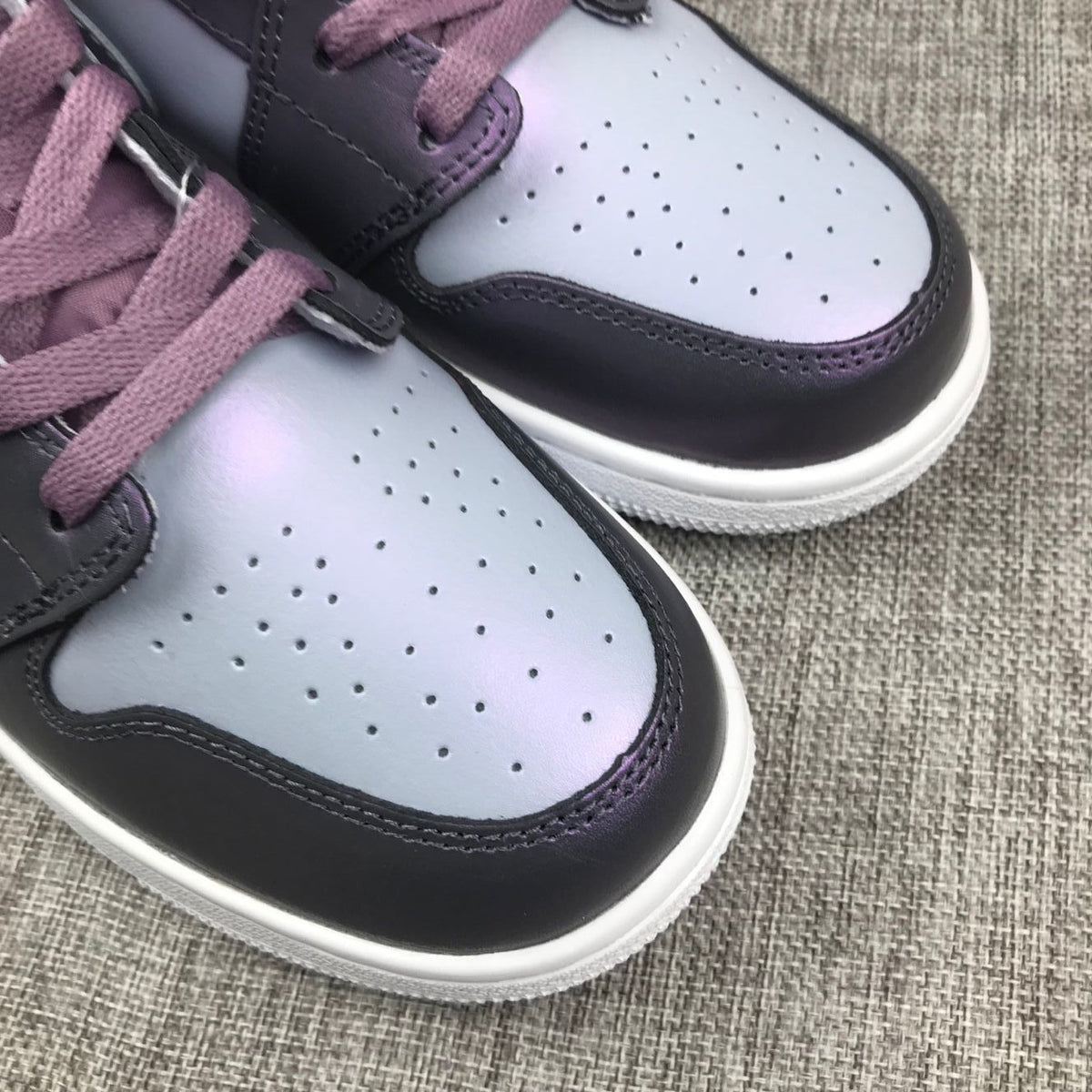 Jordan 1 Mid Sneakers in Purple AV5174-400 - product image from the listing.