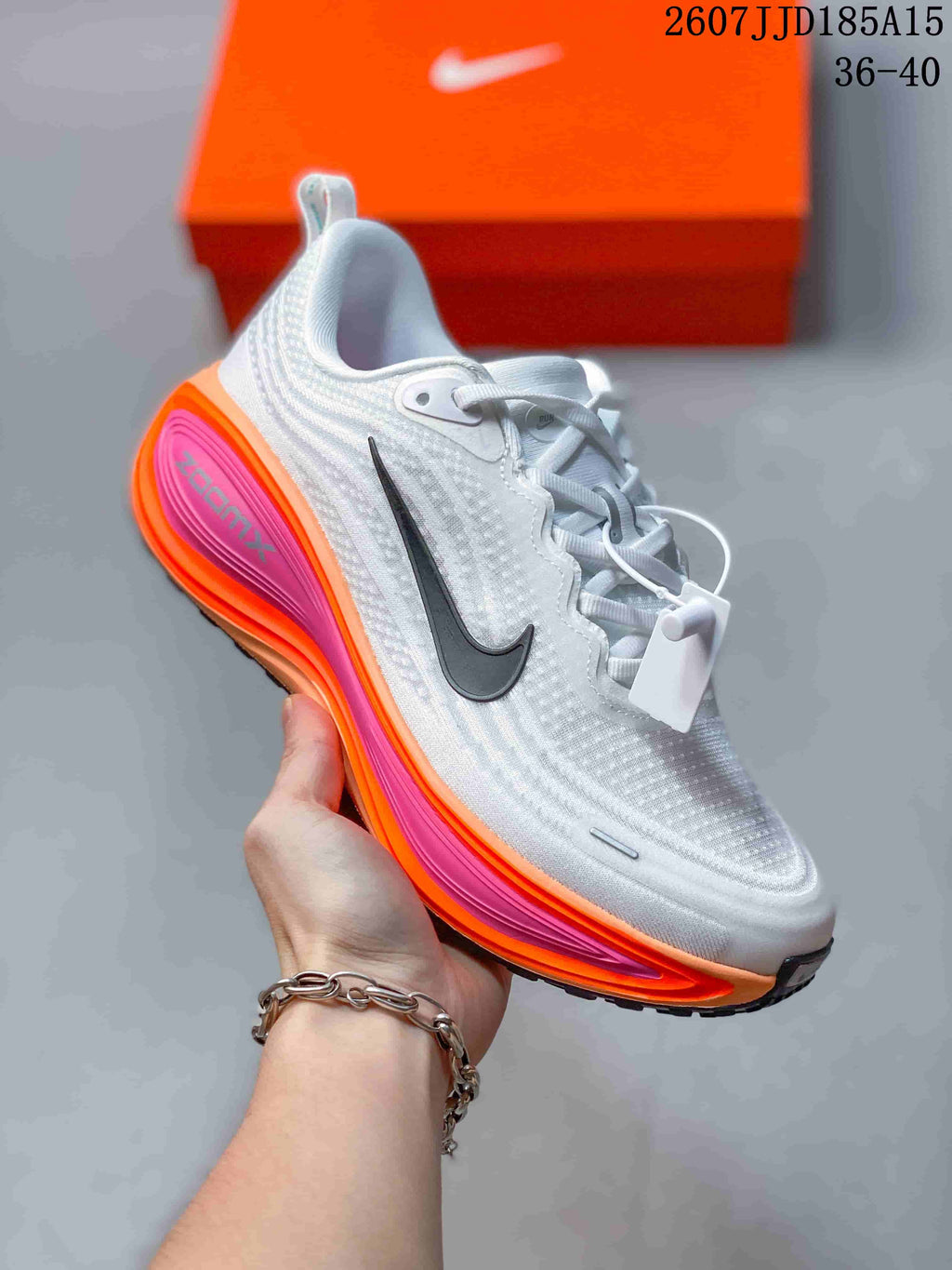 Nike Vomero Plus Running Shoes in White Orange Pink 2607JJD185A15 - product image from the listing.