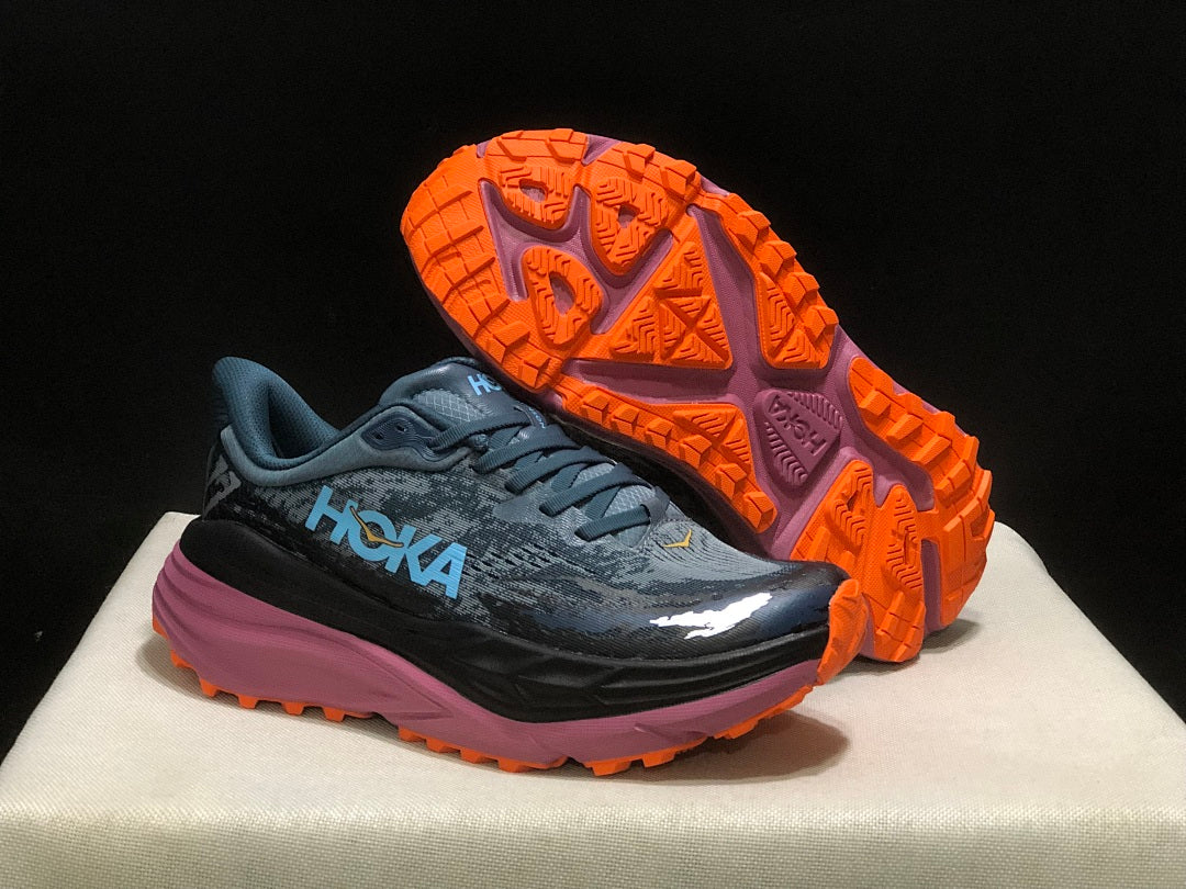 Blue and Orange HOKA Stinson 7 Trail Running Shoes - product image from the listing.