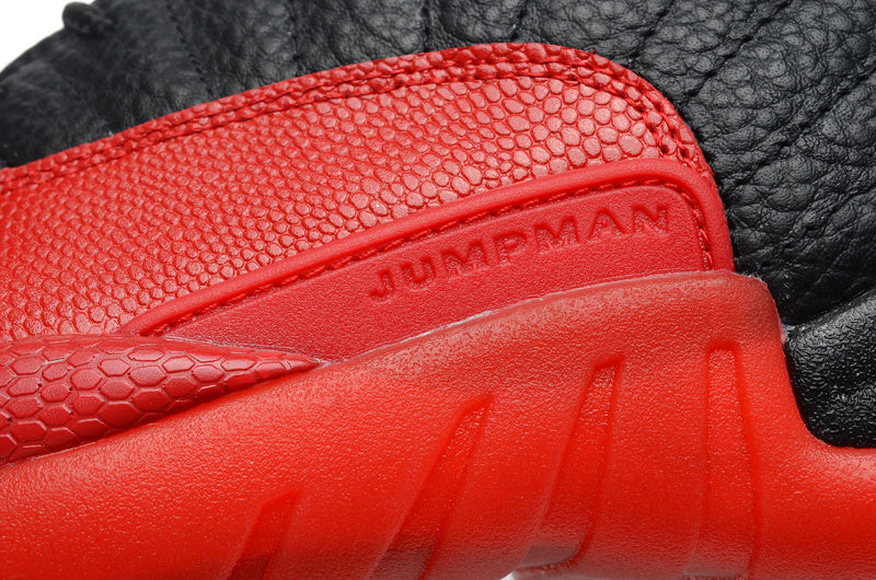 Air Jordan 12 Black and Red High-Cut Basketball Sneakers - product image from the listing.